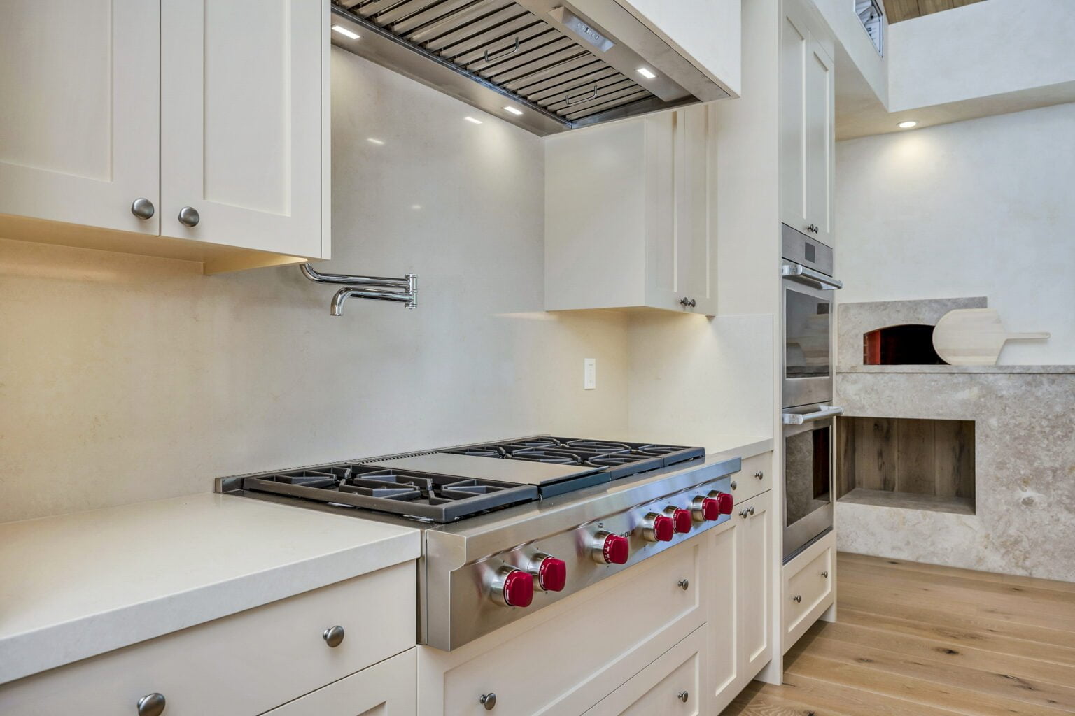 Gas burners and counters in the kitchen of Santa Rosa Hills Custom Transitional Rebuild